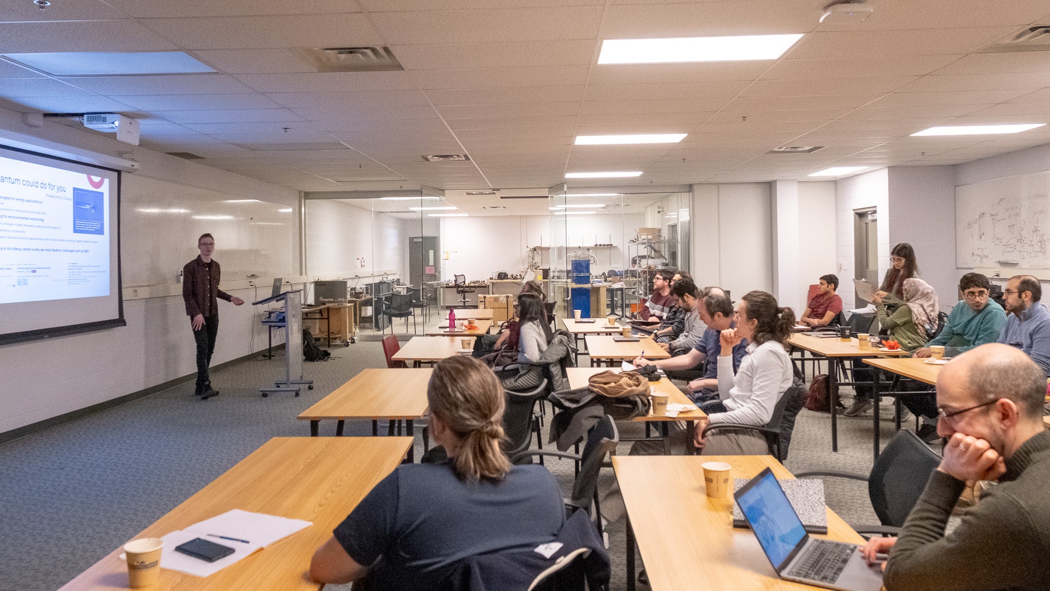 A person giving a presentation to a room full of people. 