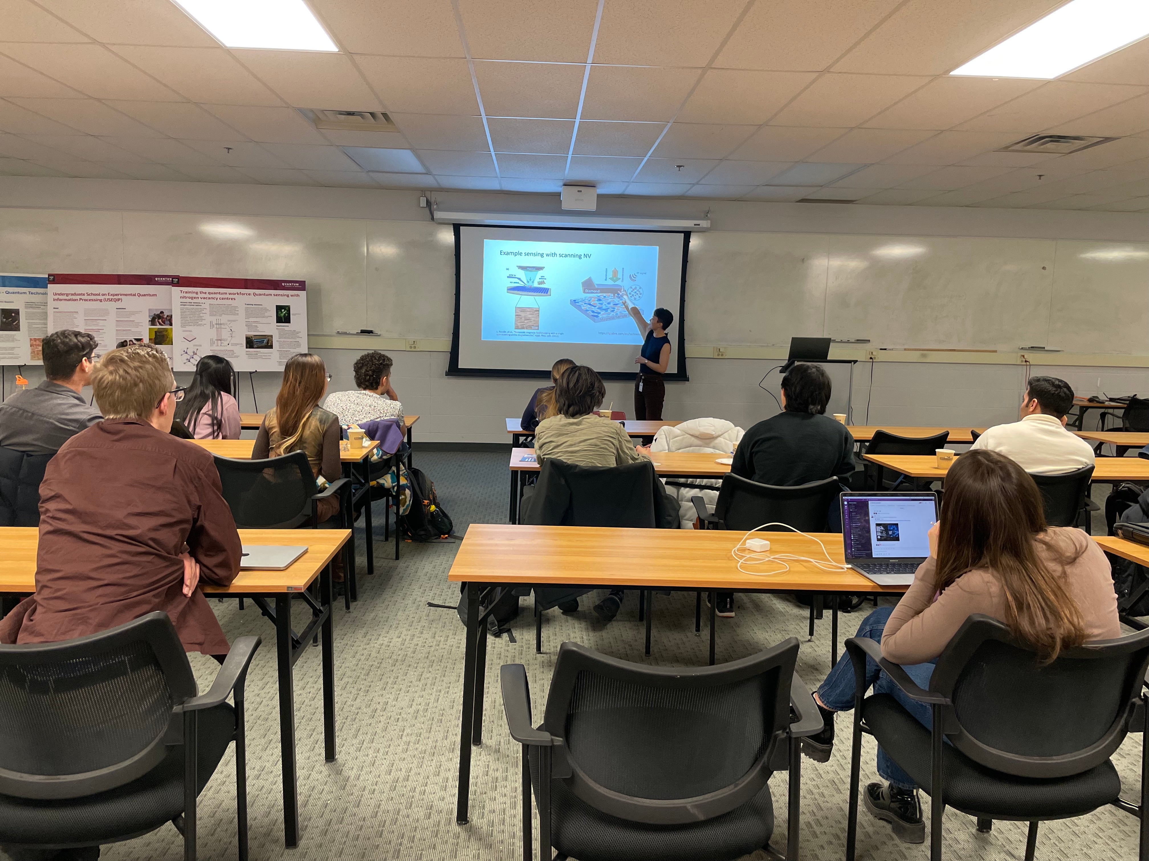 A person giving a presentation to a room full of people. 