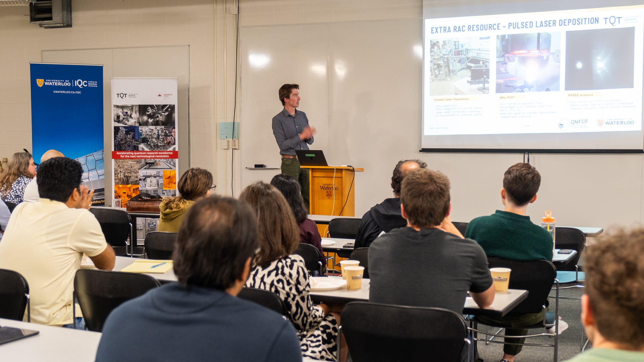 Nathan Nelson-Fitzpatrick in front of a projector screen.