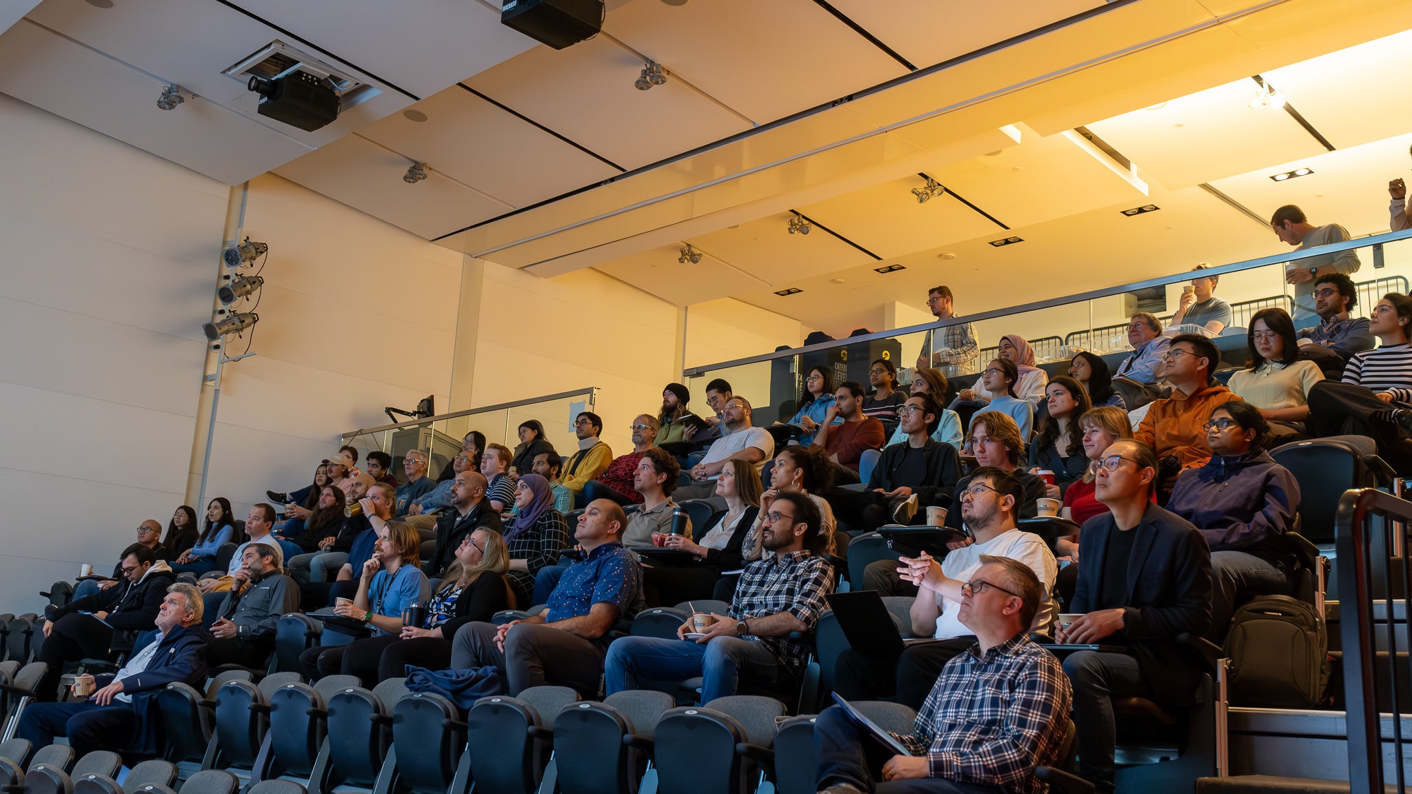 A lecture hall filled with attendees.