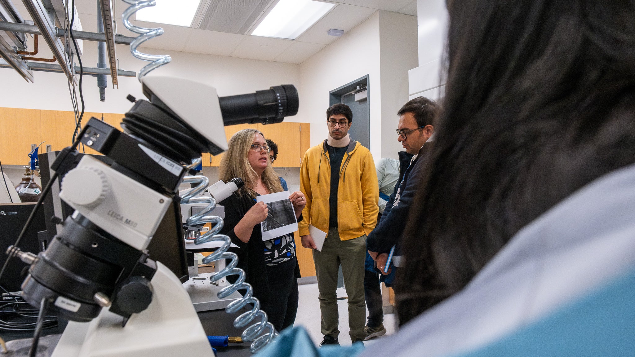 A person giving a tour of a lab