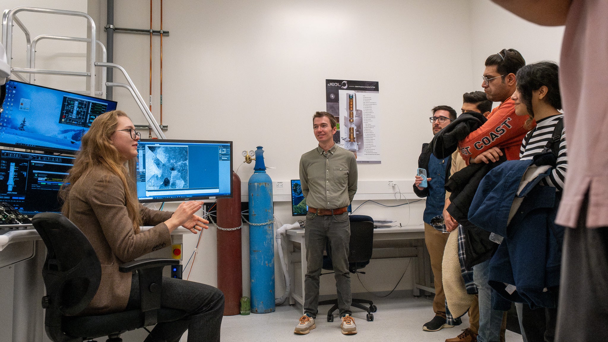 A person in front of a computer giving a demo.