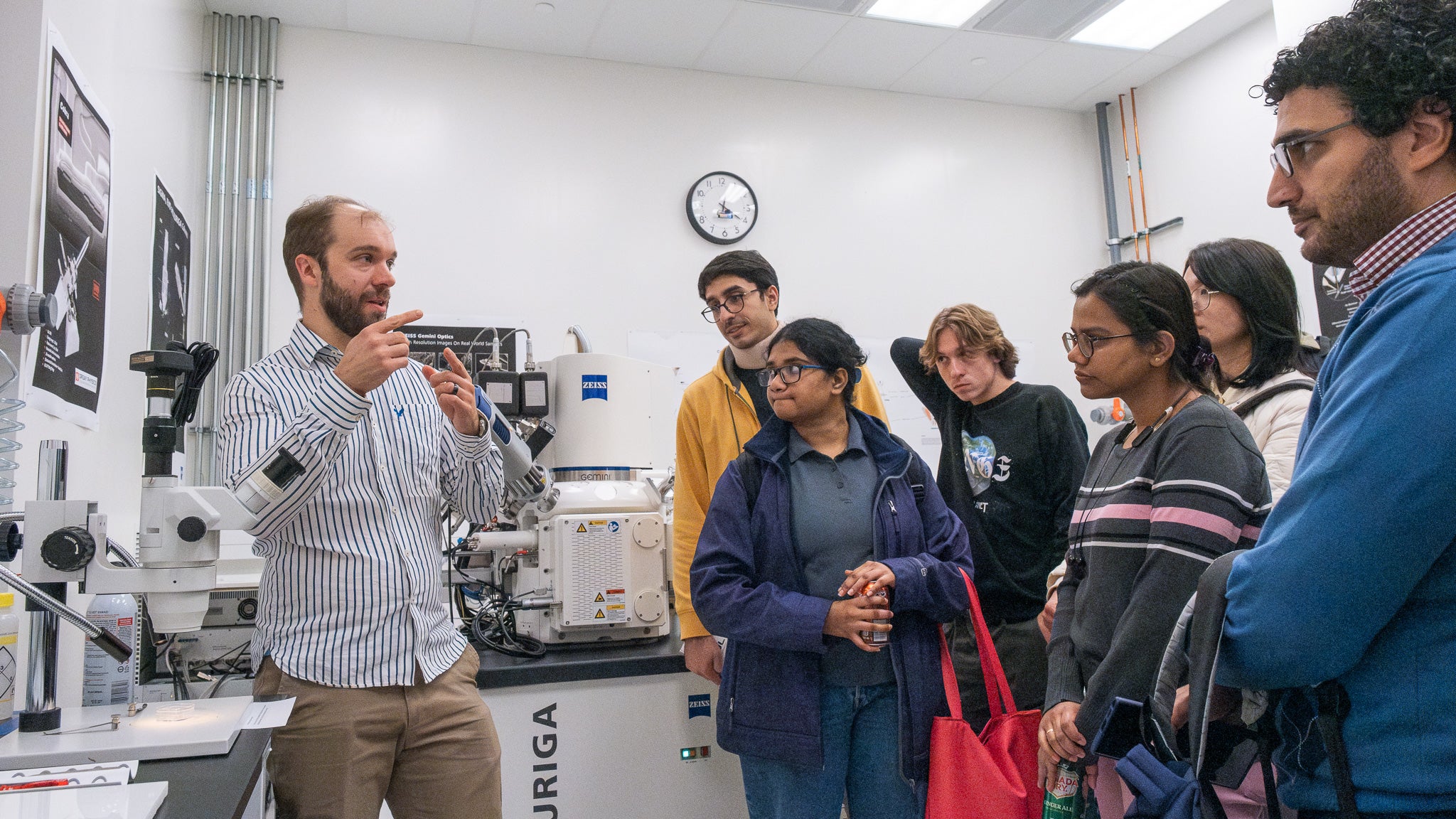 A person giving a tour of a lab