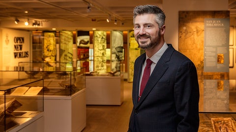 Daniel Arbino in front of archival items, University of Miami Libraries