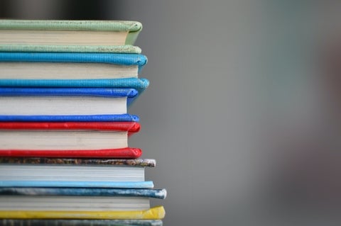 coloured bound books, image by Kimberly Farmer, Unsplash