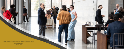 Groups of people talking and sitting with coffee cups in a well-lit hall