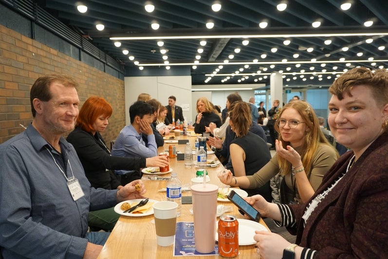 Conference attendees eating lunch
