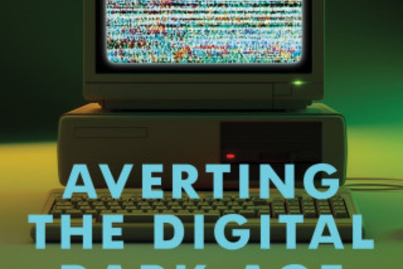 90's computer with fuzzy screen with book title on top