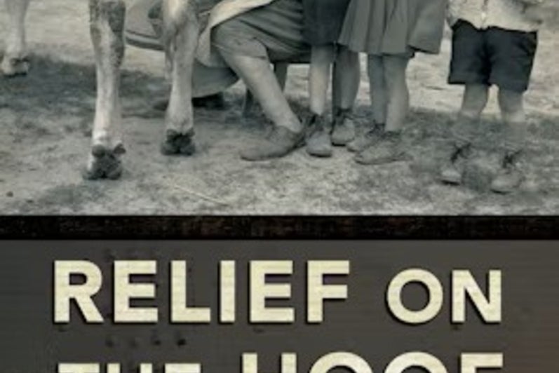 Woman milking a cow beside children, book title underneath