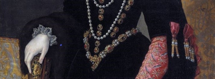 Waist of a woman in medieval dress with jewellery