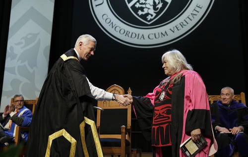 Waterloo Chancellor shaking hands with Lee Maracle at convocation ceremony