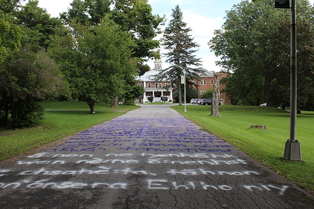Driveway with chalked writing leading to old school building
