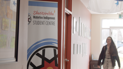 A student walking into the Waterloo Indigenous Student Centre