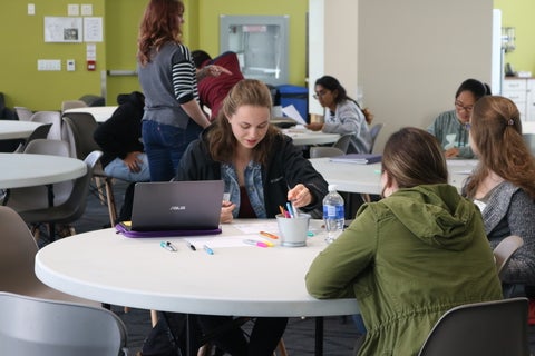 Students sitting around a table