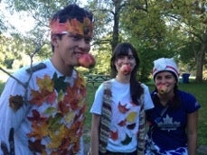 Rubin apple bobbing with United College Dungeon & Oasis floormates and friends, Kaitlin (middle) & Alex Foto (far right) during a community dinner in Fall 2013 