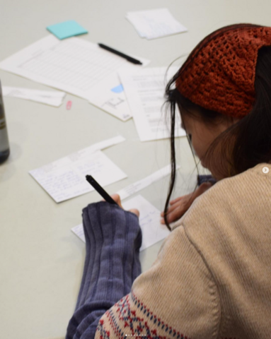 student writing a thank you card 