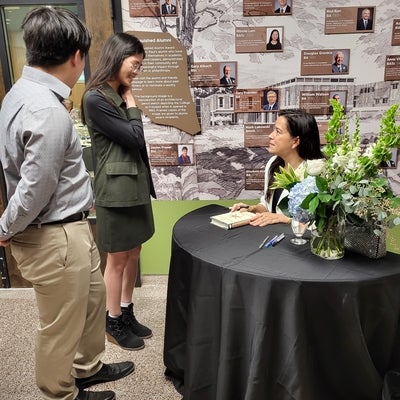 Jody Wilson-Raybould (Puglaas) signing a copy of her book for United College guests