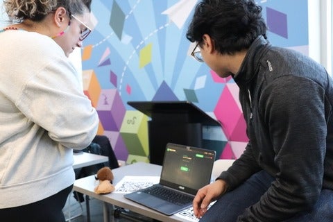 Two people experiencing Demo Day