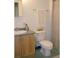 A photo of the bathroom showing the sink and toilet