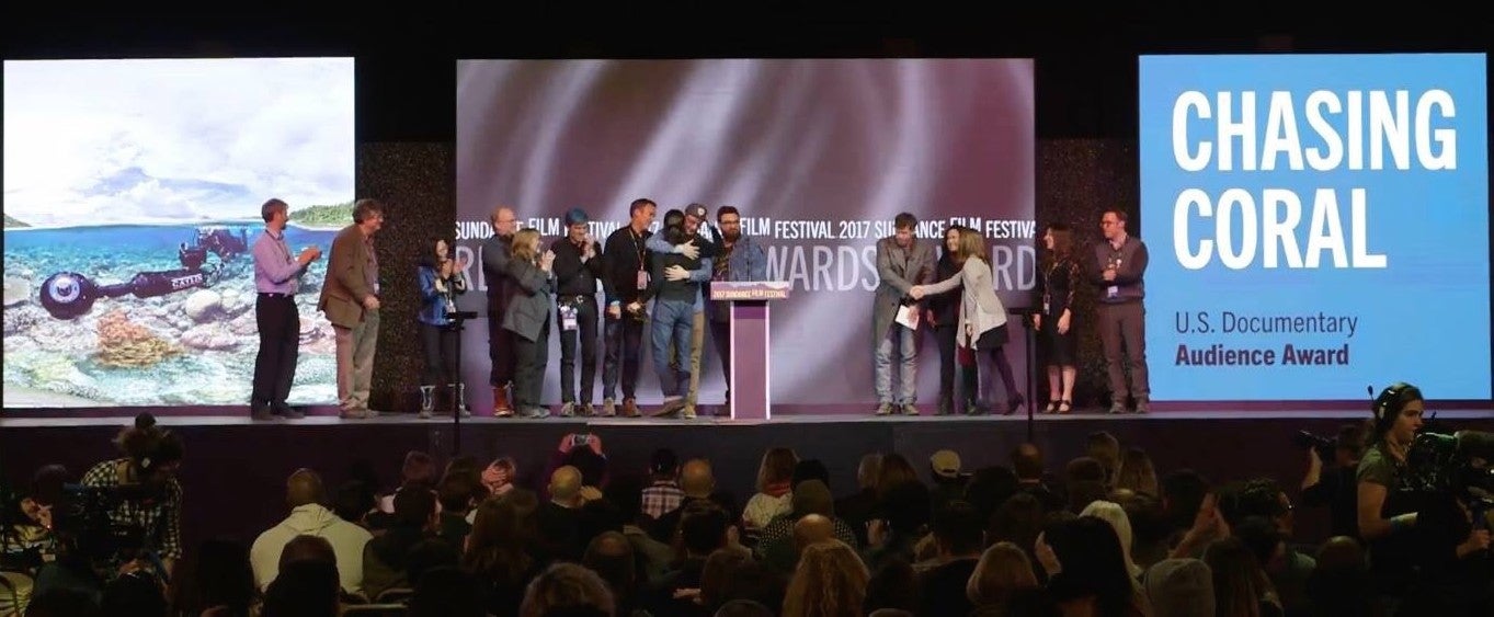 Filmmakers and producers accepting the award at Sundance