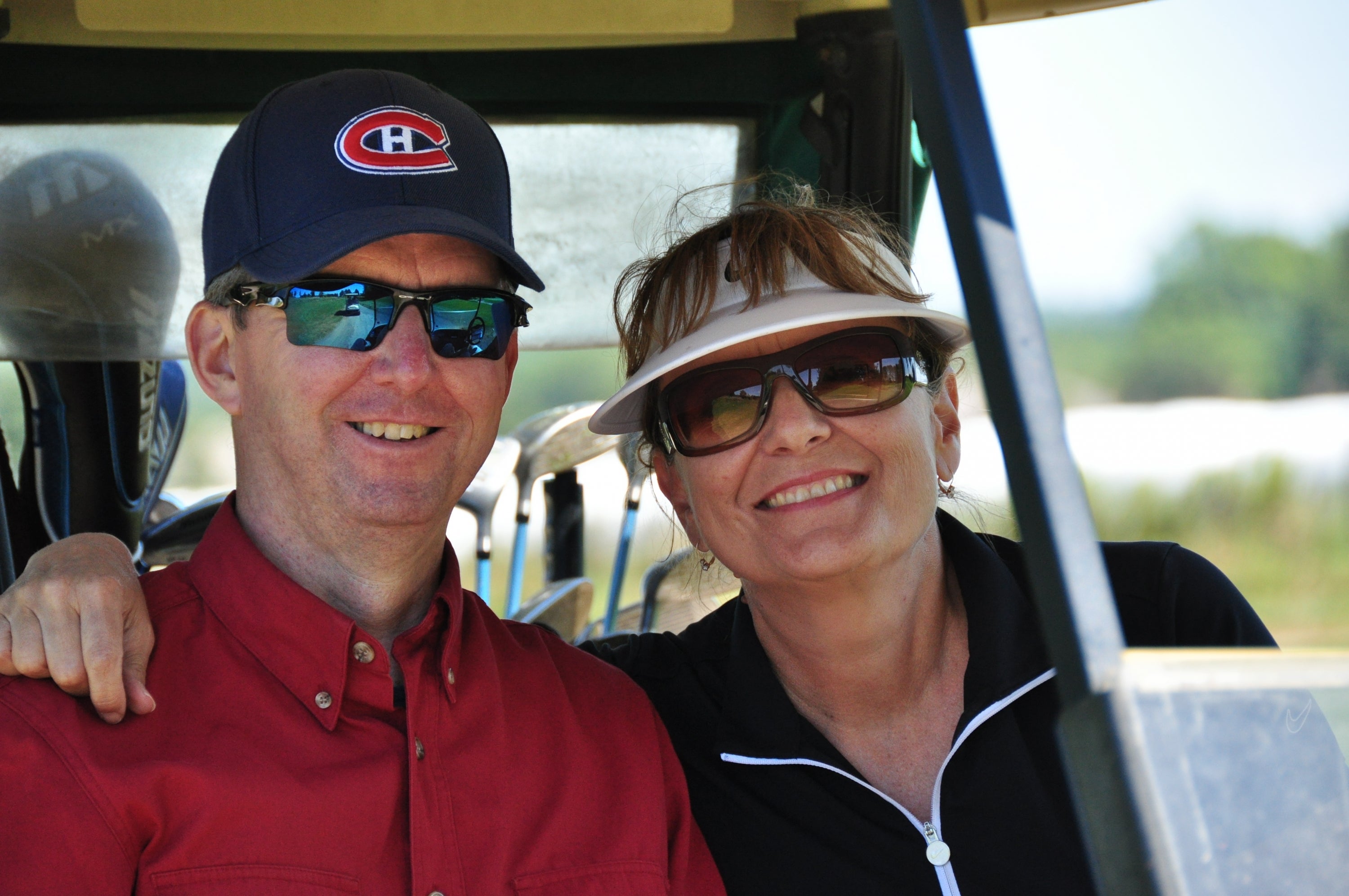 Richard and Linda on a golf cart