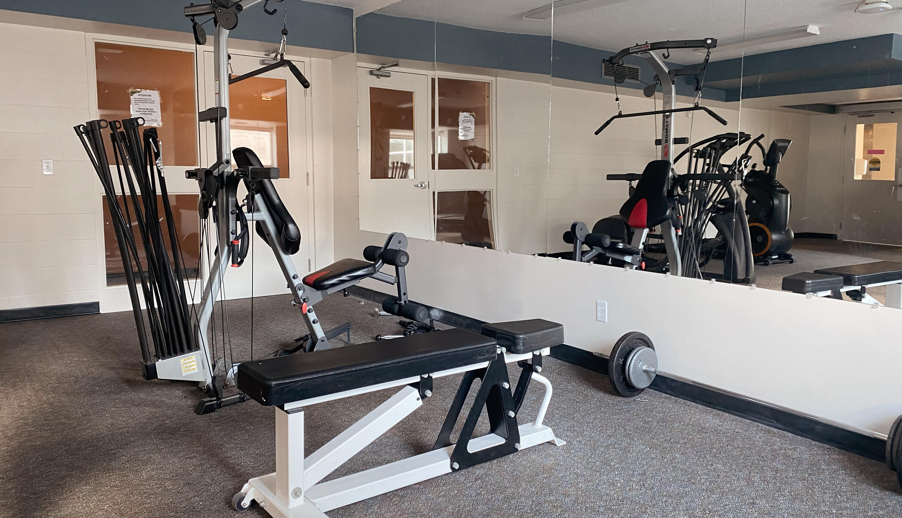 exercise bench, bowflex and gym mirrors