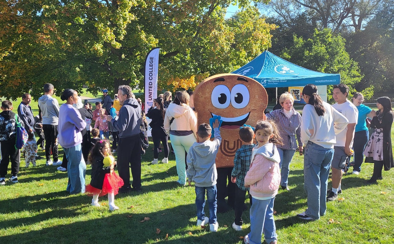 Toasty interacting with children at the Ride for Refuge Event