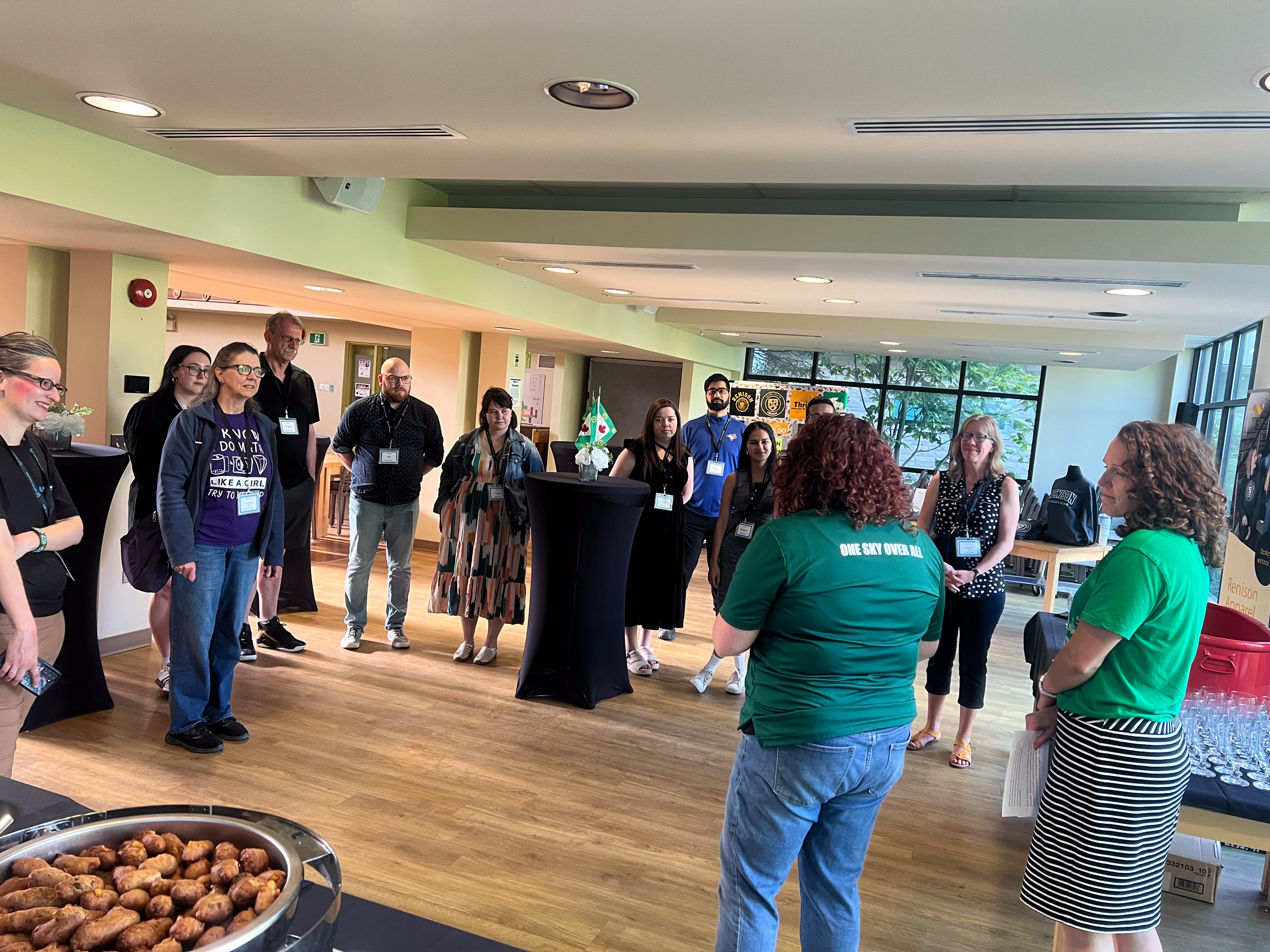 Members of Renison staff speaking to United College guests at Beer and Bites 