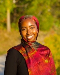 Professional portrait of a student facing the camera and smiling