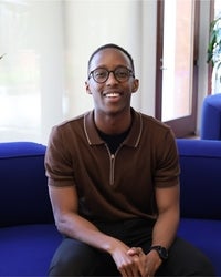 Professional portrait of a student facing the camera and smiling