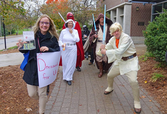 Landon and five of the deans dressed as Star Wars characters