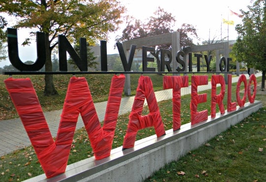 The University of Waterloo sign wrapped in red