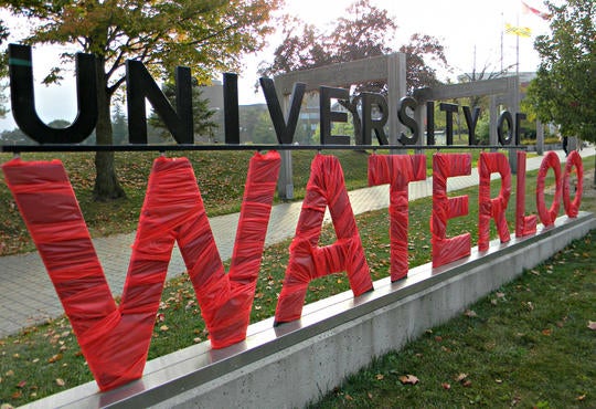 The Waterloo Entrance Sign wrapped in red
