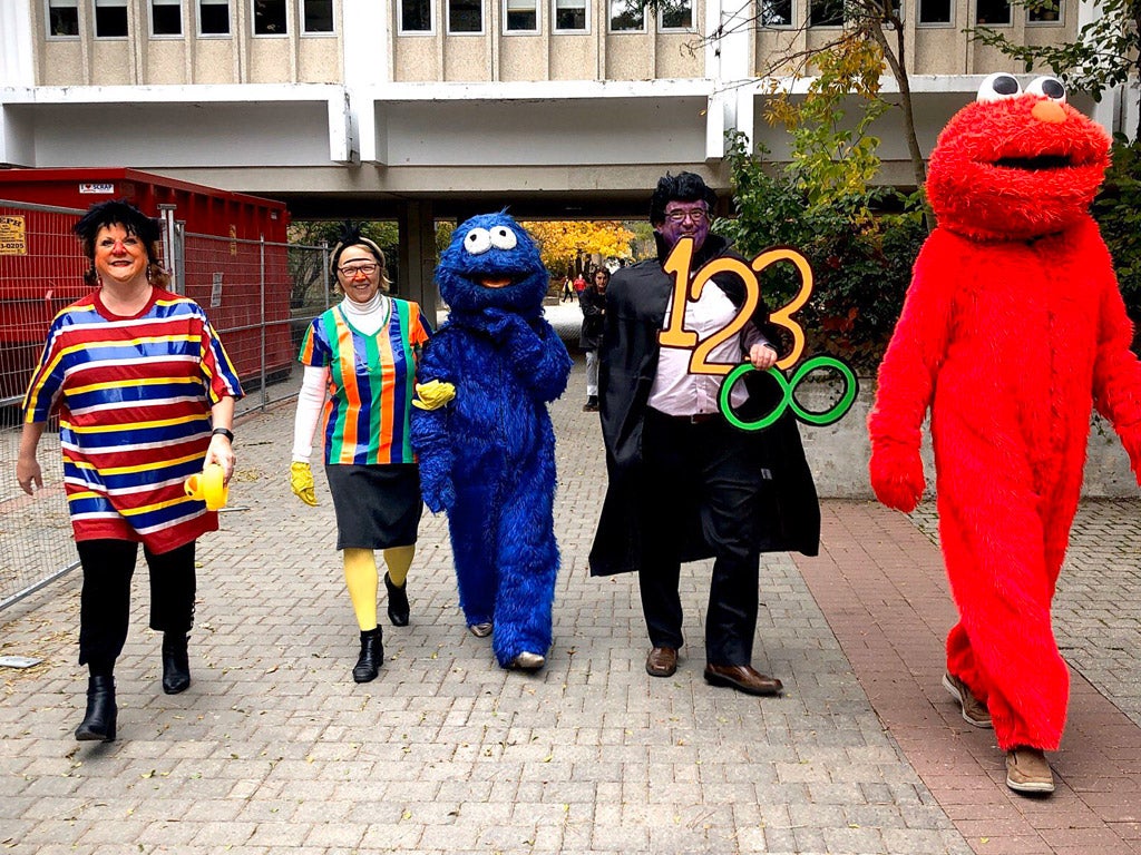 The deans march through campus dressed up