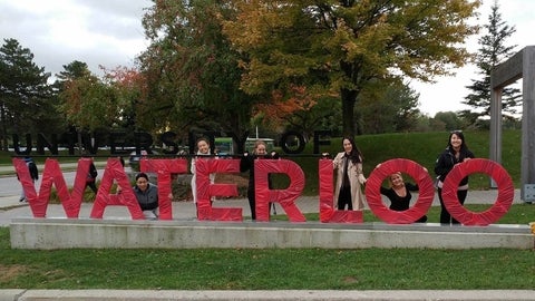 University of Waterloo sign wrapped in red paper for United Way
