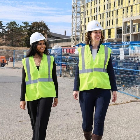 Leia Minaker and student walking near construction