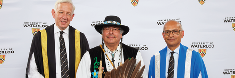 Indigenous Knowledge Keeper Myeengun Henry (center) pictured with President Vivek Goel (right) and Chancellor Dominic Barton (left) conducted an Indigenous opening and closing featuring drumming and remarks at the University of Waterloo 2022 Convocation ceremony.