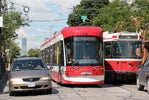 Bus, car and street car in Toronto