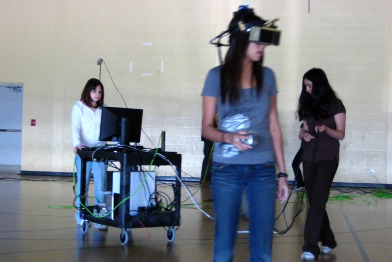 A female participant wearing head-mounted display in the gym