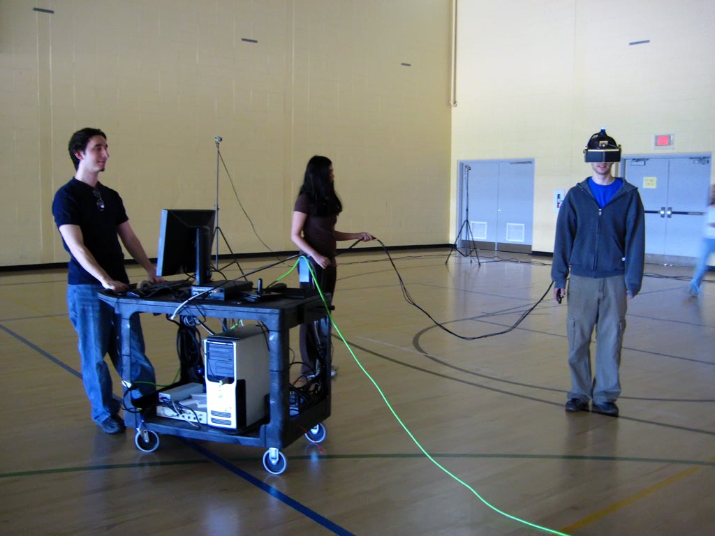 A male participant wearing the head-mounted display in the gym