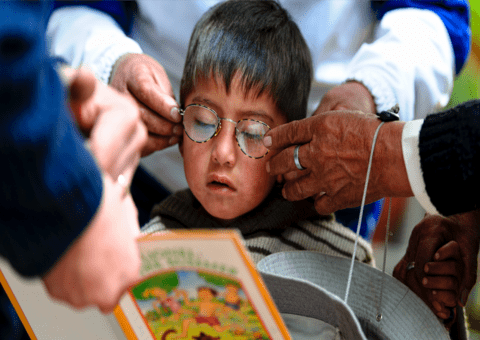 A child is being tested for new glasses