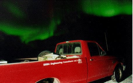 Northern lights over a truck