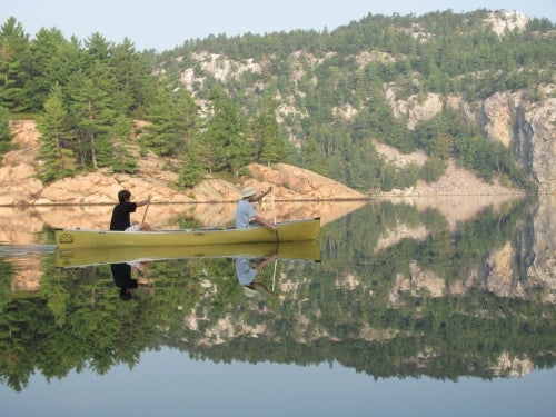 Tyler and his brother canoeing in Killarney Provincial Park