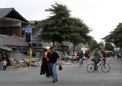 damaged street with people