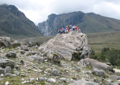 Field trip group on Pleistocene moraine to the west of the sharp fault-bounded front of the Cordillera Blanca batholith.