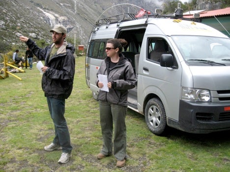 Student presentation at Laguna Paron with the Toyota Hiace minibus used during trip.