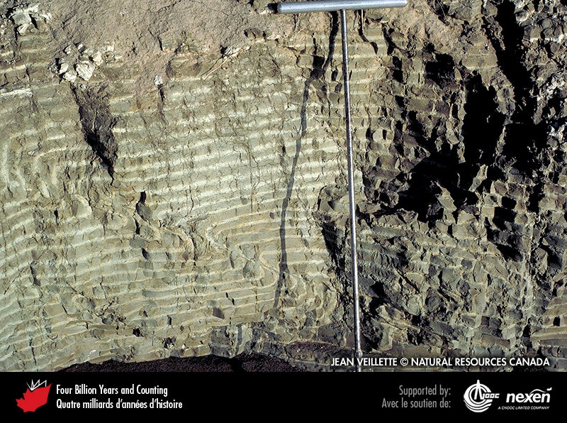 Cyclic varve sediments from a glacial lake like Lake Agassiz; appears as a stripped rock formation.
