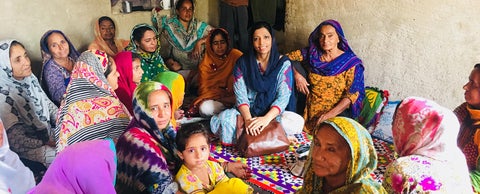 Queen Elizabeth Scholar Sajida Awan in a Pakistani village conducting interviews with local farmers.