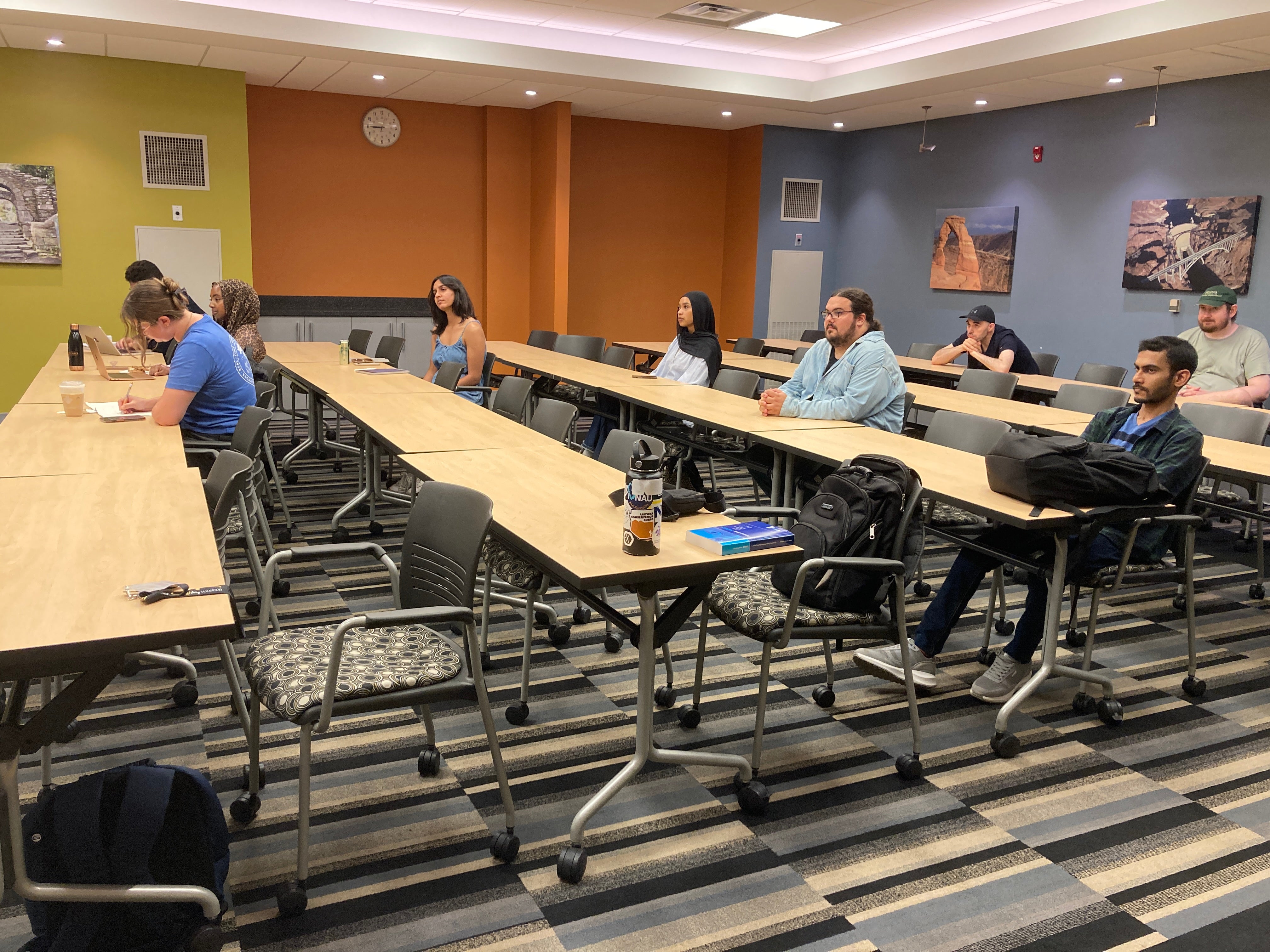 Room with students sitting next to tables at the career panel event