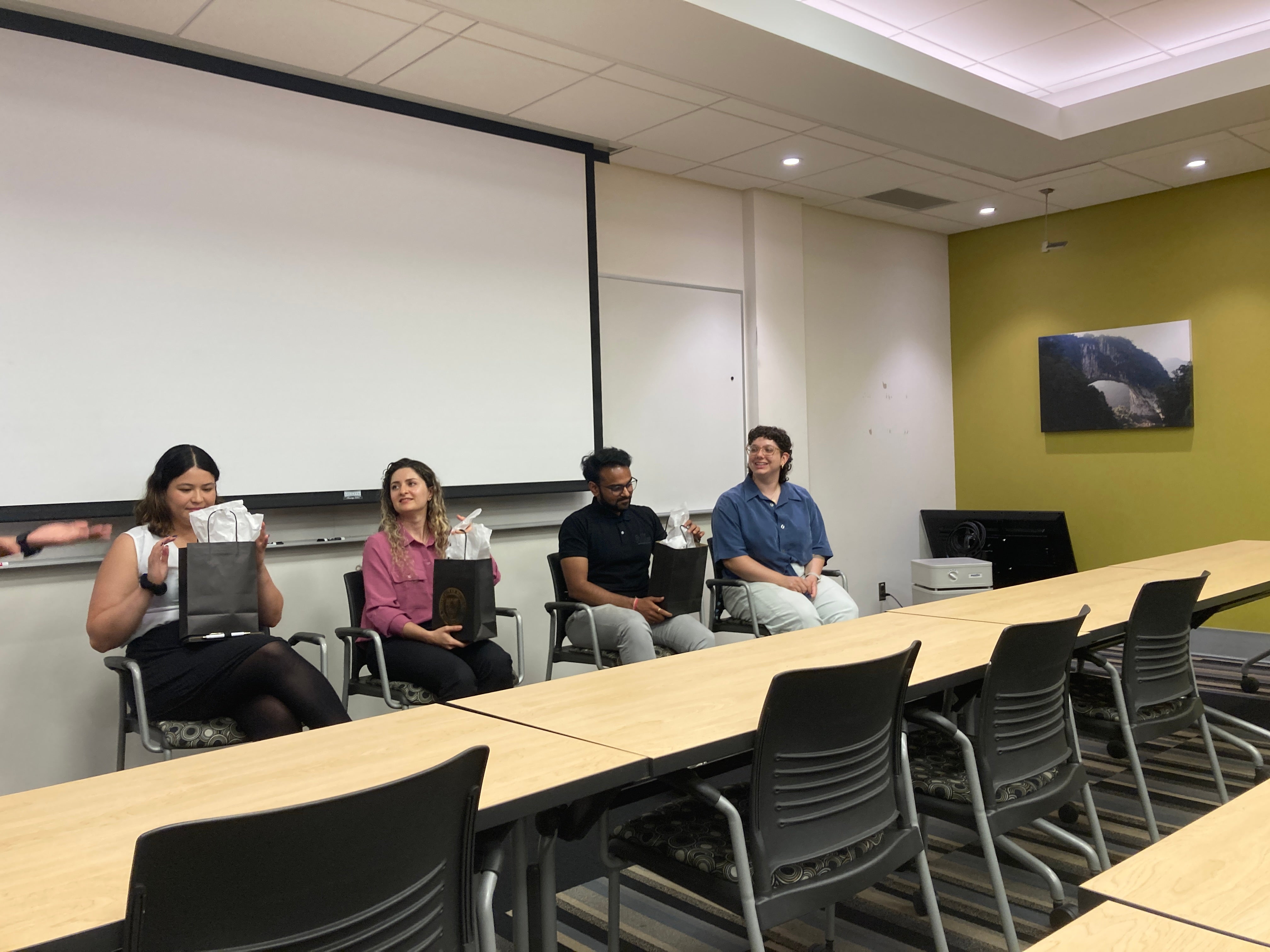 Room with students sitting next to tables at the career panel event